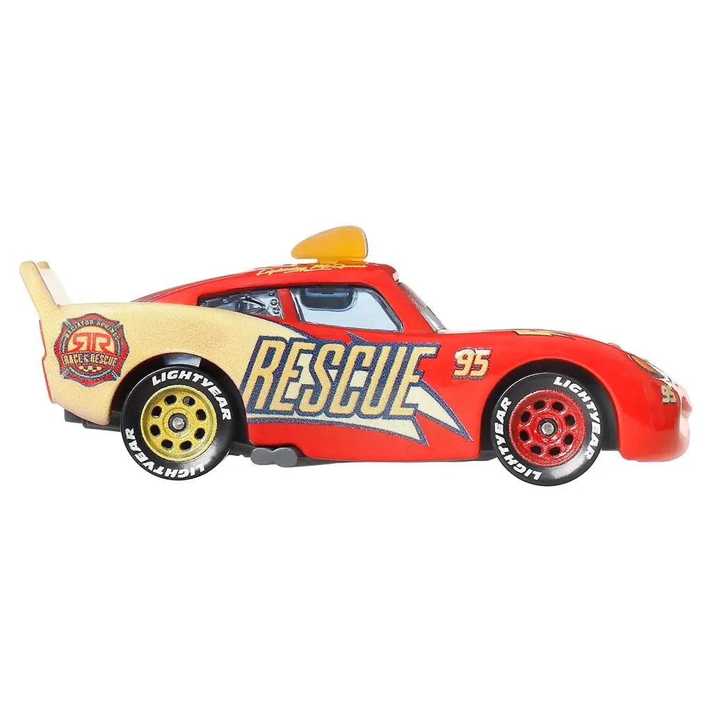Lightning McQueen rescue edition diecast in red metal with tan side panels, low-profile race car shape, large Rescue 95 lettering, roof emergency light, and detailed wheels shown in a clean side view setting.