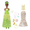 Disney Princess Tiana doll in sparkling green ballgown with floral patterns, matching tiara, gloves, necklace, and shoes, holding frog accessory for fairytale adventures.