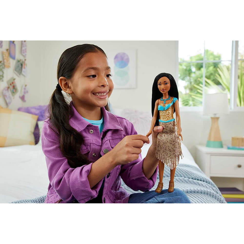 Girl playing with Disney Princess Pocahontas Fashion Doll