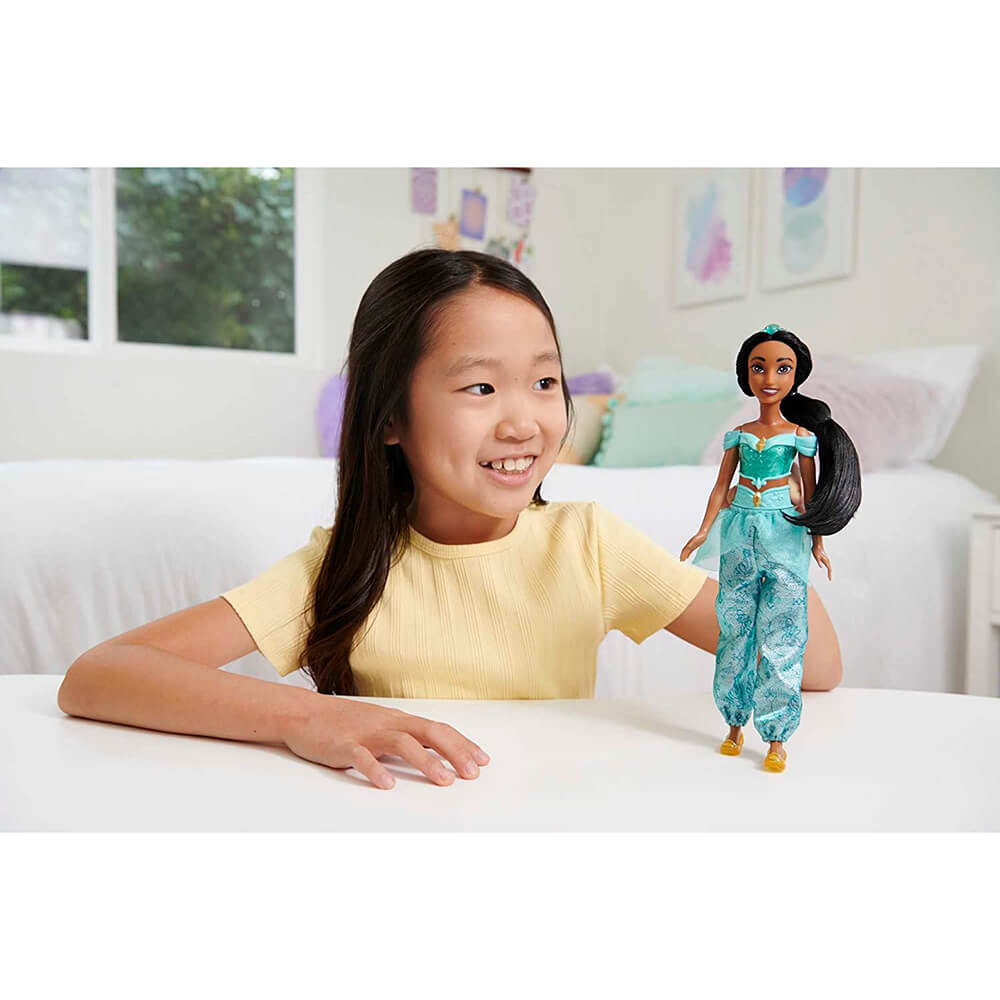 Girl playing with Disney Princess Princess Jasmine Fashion Doll