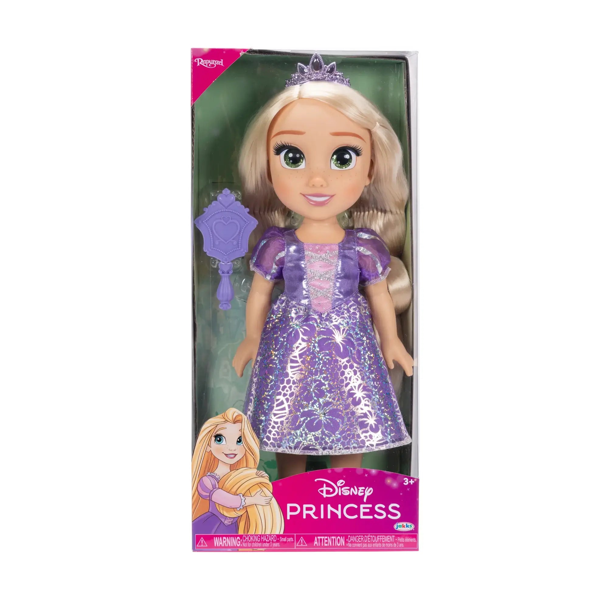 Disney Princess Rapunzel doll in a purple satin-look floral gown and jeweled tiara, packaged with a lavender brush in a pink display box on a white background.