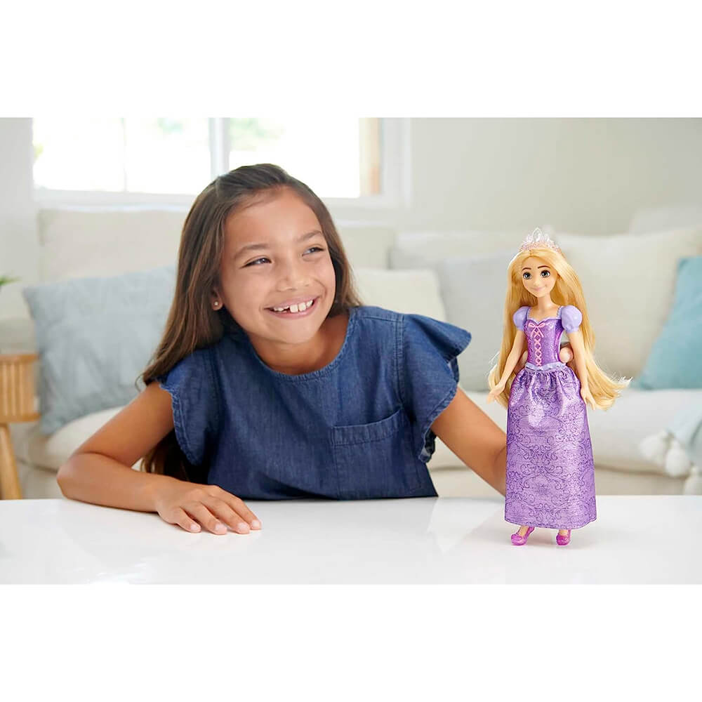 Girl playing with the Disney Princess Rapunzel Fashion Doll