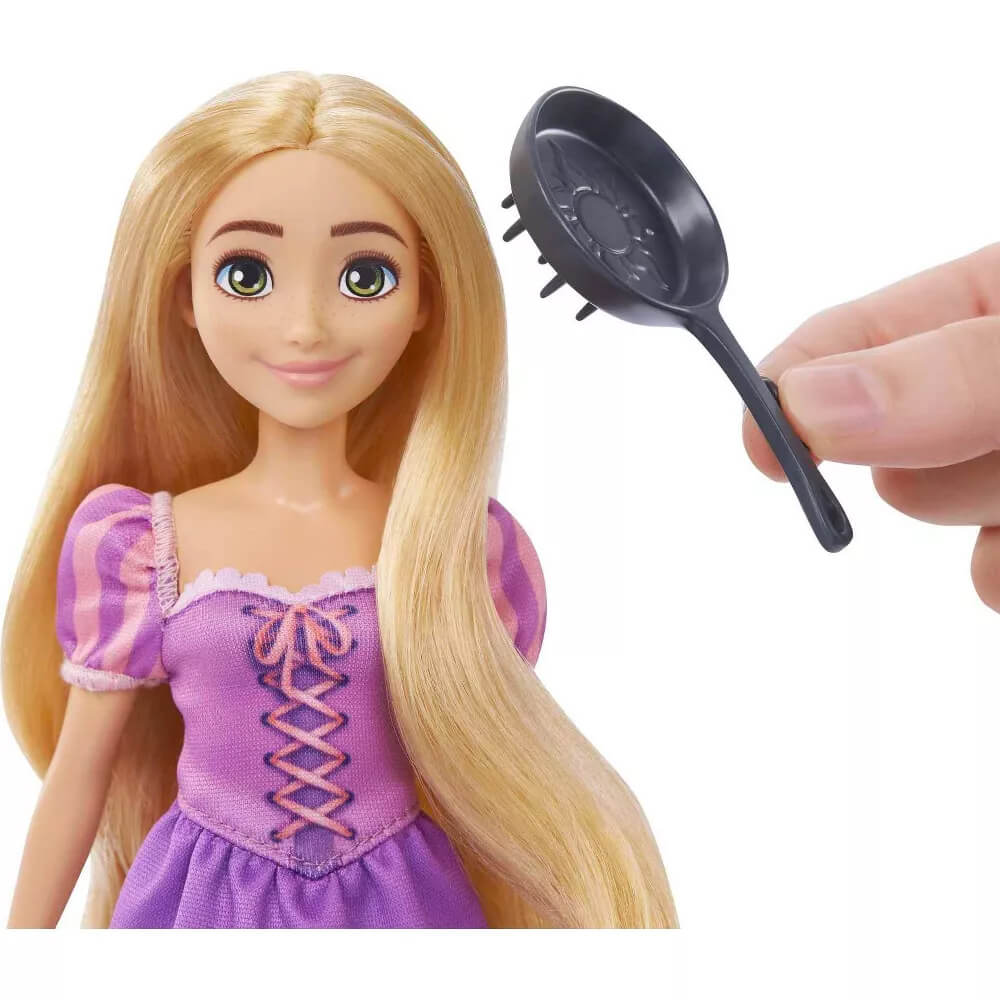 Doll from waist up shown with fryinging pan that is included with the Disney Princess Rapunzel & Maximus Play Set