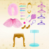 Collection of Disney Princess doll accessories including a skirt, shoes, and various items on a beige background.