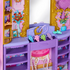 Toy vanity with mirror, shelves, and decorative items in a colorful setting