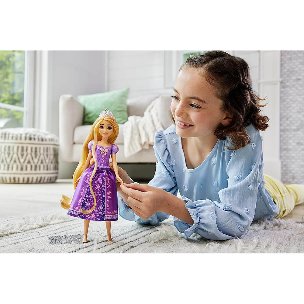 Girl playing with Disney Princess Singing Rapunzel Doll