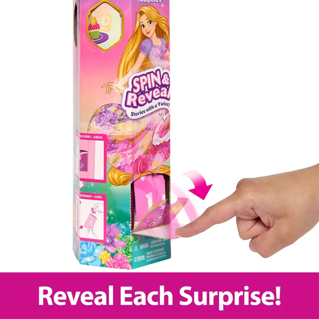 A hand lifts a perforated panel on the side of the Rapunzel Spin & Reveal toy box to uncover a hidden surprise, part of the interactive reveal feature.
