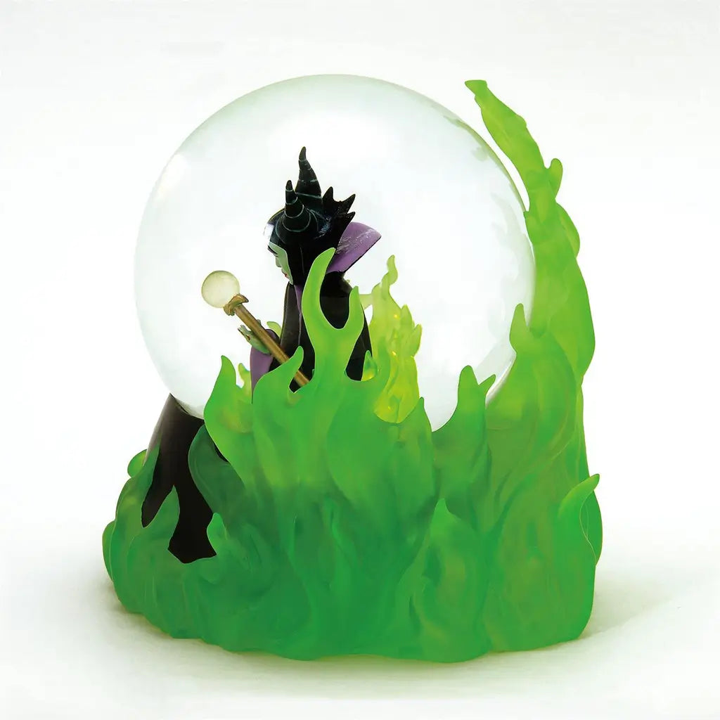 Alternate side angle of Disney Showcase Maleficent waterball with green flames, curved horns, and staff; detailed light-up villain-themed snow globe.
