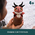 How to Train Your Dragon red mini plush in soft textured fabric with black horns and cream belly, popping out of a brown totem capsule for surprise unboxing play.