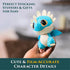 How to Train Your Dragon blue mini plush in soft textured fabric with cream belly, small wings, and embroidered eyes, held in hand to show film-accurate character details indoors.