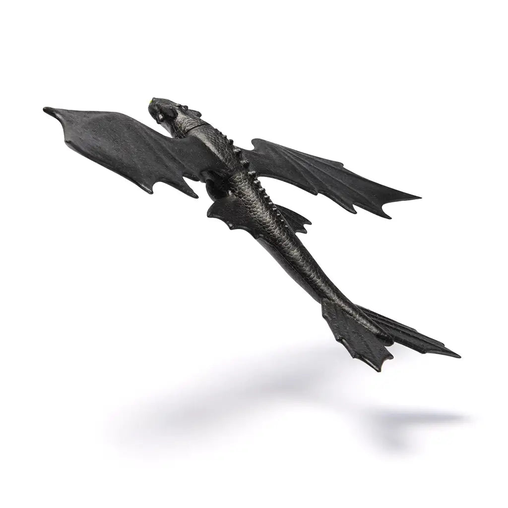 Angled rear view of the Soaring Toothless glider toy showing textured black wings and aerodynamic tail fins, designed to mimic Toothless’ sleek flight form from DreamWorks’ How to Train Your Dragon.