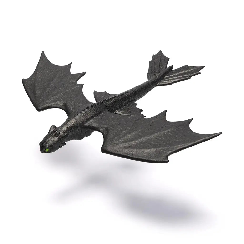 Black Soaring Toothless glider toy with detailed scale texture, broad wings, and aerodynamic shape, modeled after the Night Fury dragon from How to Train Your Dragon.