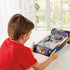 Boy in a red shirt sits at a table playing Epoch Game Zone electronic arcade pinball, focusing on flippers and scoring on the bright neon playfield.