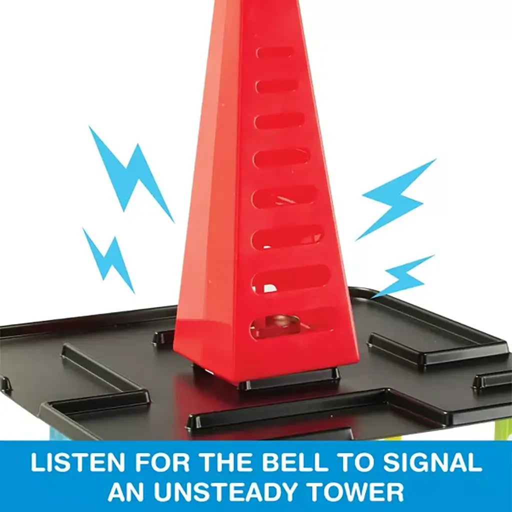 Close-up of red plastic bell cone placed on top of Tumbling Tower game, signaling when the tall stack of black shelves and colorful pillars becomes unsteady during play.