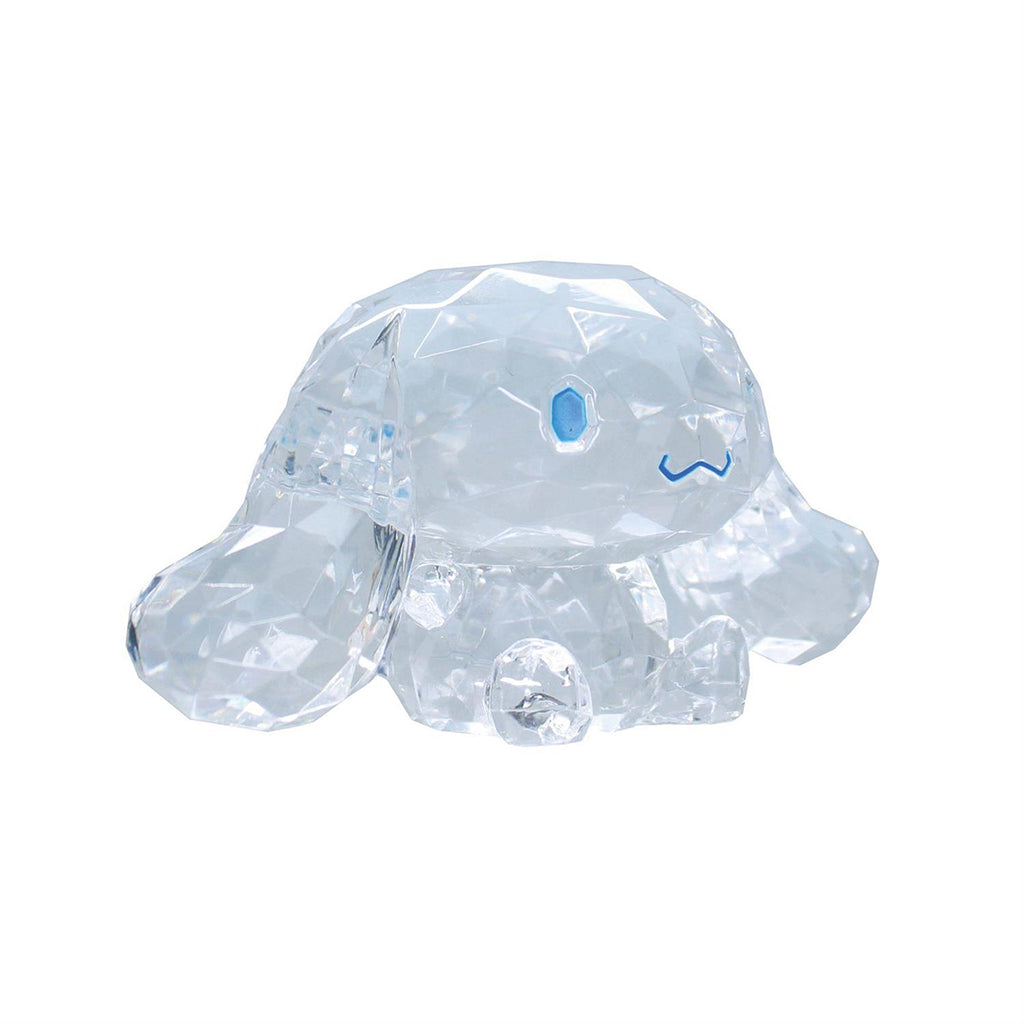 Side view of faceted crystal Cinnamoroll figure with blue facial details and long ears, designed as a decorative Sanrio character display piece.