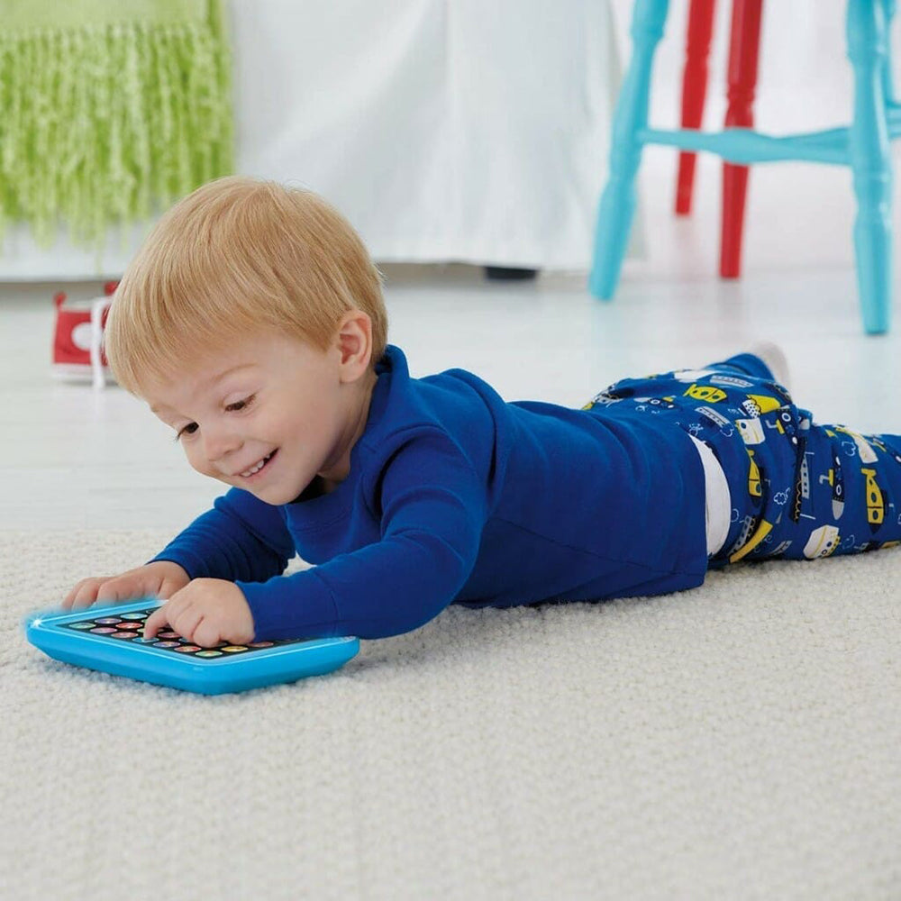 Baby laying on his belly using the Smart Stages Tablet 
