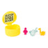 Gabby's Dollhouse surprise accessory capsule in glossy yellow plastic with hinged lid revealing QR code inside, shown open beside small music-themed toy pieces on a white surface.