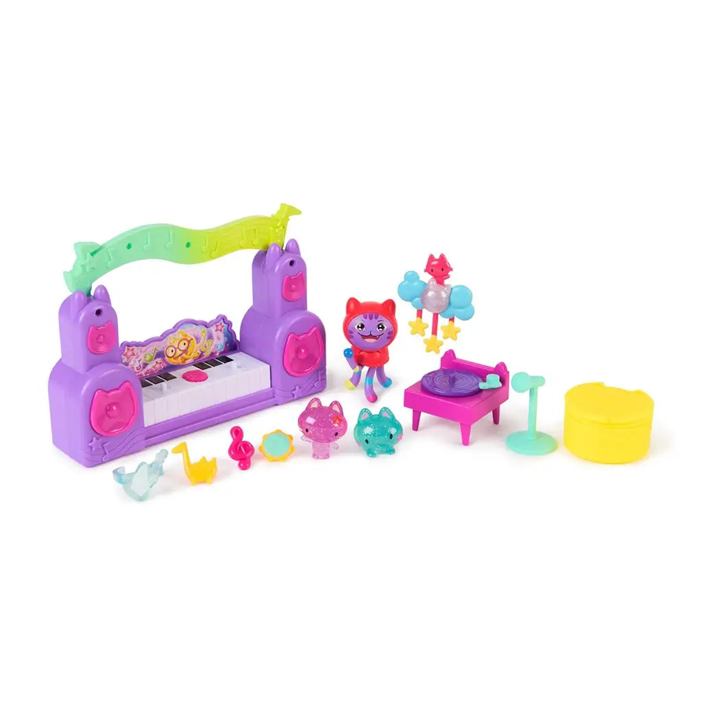 Gabby's Dollhouse The Movie Paw-some Party Story set in colorful molded plastic with stage, microphone stand, DJ table, yellow surprise capsule, and multiple mini cat figures displayed together.