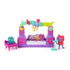 Gabby's Dollhouse The Movie Paw-some Party Story playset in purple and pink plastic with cat-shaped speakers, rainbow music arch, keyboard stage, and mini cat figures arranged on a white background.