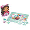 DreamWorks Gabby’s Dollhouse 48-piece puzzle featuring Gabby and her cat friends on a colorful teal background with confetti, shown beside its cat-ear-shaped storage box.