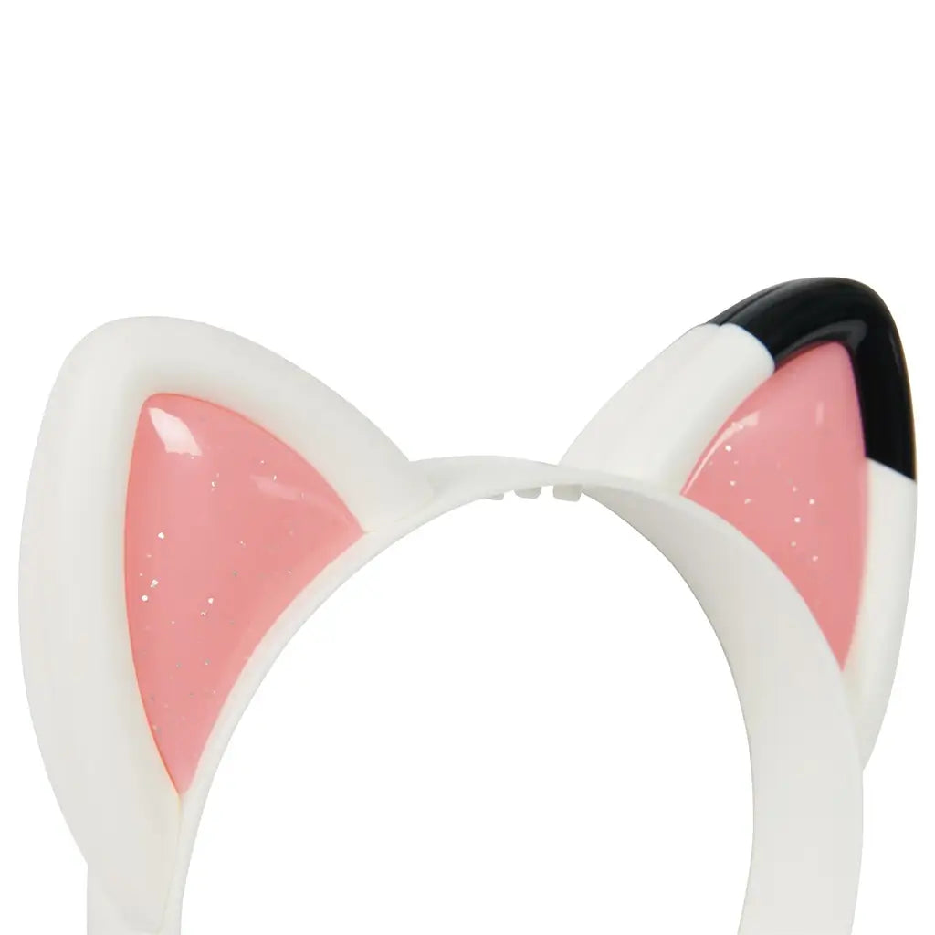 Close-up of Gabby’s Dollhouse cat ear headband showing glossy pink glitter centers and smooth white and black plastic frame, emphasizing the playful cat-inspired design.