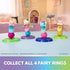 Gabby's Dollhouse fairy ring collectibles in colorful plastic with four winged cat figures balanced on glittery bases, arranged in a pastel playroom setting for imaginative display.