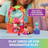 Gabby's Dollhouse Flutter Fairy playset in coral and teal plastic with small winged cat figures posed on ring perches, shown in a child’s hands for creative dress-up play.