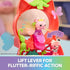 Gabby's Dollhouse flutter lever feature in coral plastic with a pink fairy cat figure lifted on a translucent purple seat, wings extended inside a cat-ear frame.