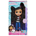 Gabby's Dollhouse Gabby Girl doll in teal and purple cardboard packaging with clear plastic display window, featuring curly-haired fashion doll and removable cat ears inside a retail box.