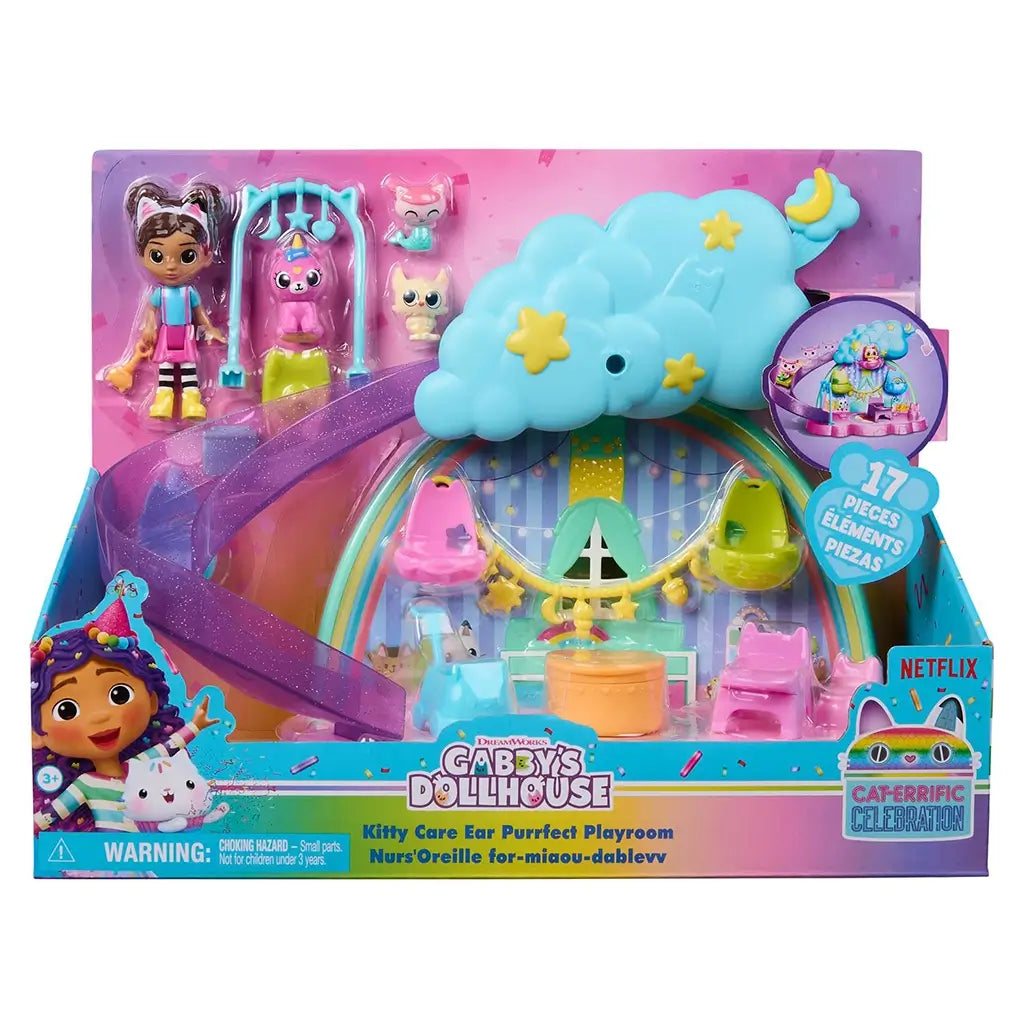 DreamWorks Gabby's Dollhouse Kitty Care Ear Purrfect Playroom packaged in bright pink and teal cardboard box with clear window, slide, figures and 17-piece badge on retail display.