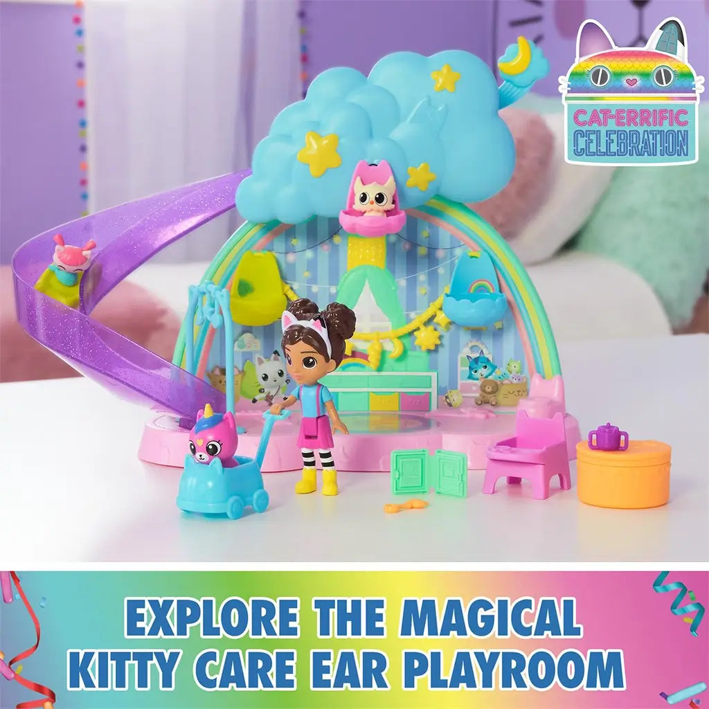 DreamWorks Gabby's Dollhouse Kitty Care Ear Purrfect Playroom playset in pastel plastic rainbow colors with cloud slide, yellow stars and mini figures arranged on a tabletop nursery scene.