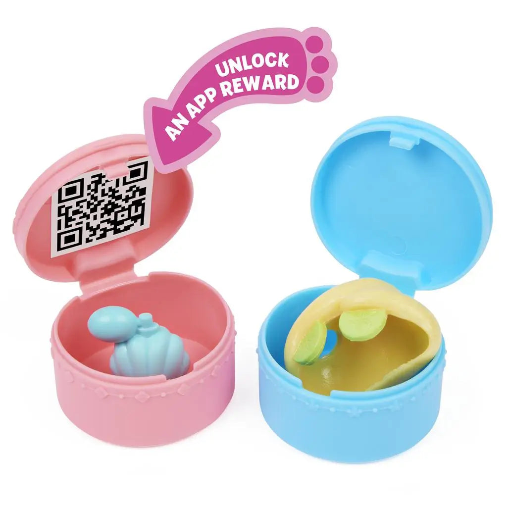 Gabby’s Dollhouse toy capsules in pink and blue plastic with smooth rounded shape, hinged lids and QR code inside, designed for surprise accessory rewards, displayed on a clean white background.
