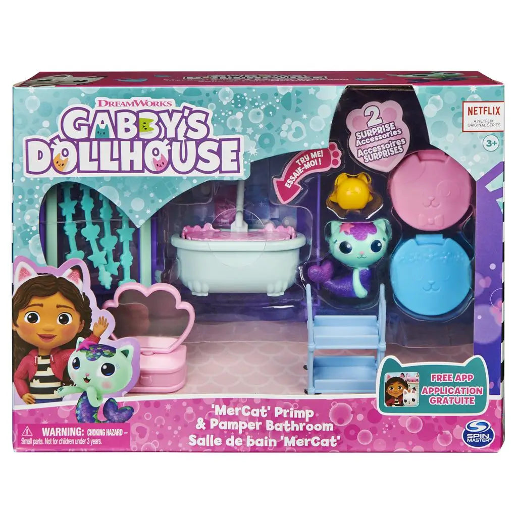 Gabby’s Dollhouse retail packaging in teal, pink, and purple cardboard with plastic window, showcasing Mercat bathroom playset and accessories, displayed against a clean white background.