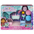 Gabby’s Dollhouse retail packaging in teal, pink, and purple cardboard with plastic window, showcasing Mercat bathroom playset and accessories, displayed against a clean white background.