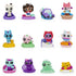 Colorful plastic Gabby’s Dollhouse mini figures, including cats, animals, and vehicles, arranged in three rows on a white background, showcasing collectible toy designs with large expressive eyes.