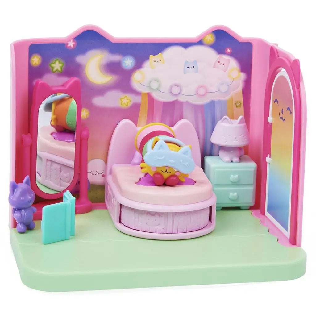 Gabby’s Dollhouse Pillow Cat bedroom playset in pink, purple, and pastel plastic with smooth rounded furniture shapes, cozy bed, mirror, and nightstand arranged in a dreamy cartoon-style room backdrop.