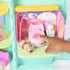 Gabby’s Dollhouse transforming bed feature in pastel pink plastic with rounded shape and soft details, small figure interacting with bed in cozy room scene, demonstrating play function on white background.