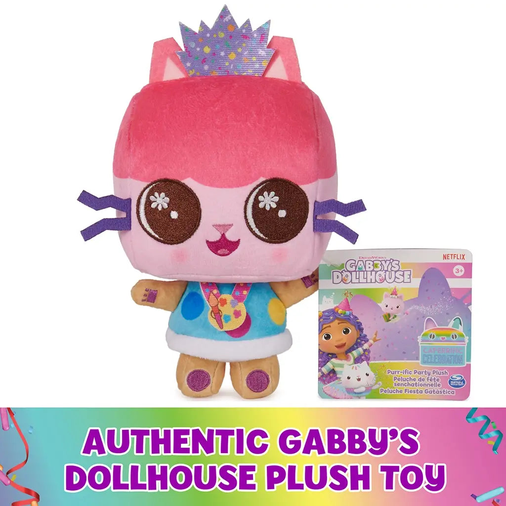 Gabby’s Dollhouse plush toy in pink soft fabric cube-shaped cat form with embroidered facial details, crown, and multicolor outfit, displayed upright beside branded packaging on a clean white background.