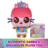 Gabby’s Dollhouse plush toy in pink soft fabric cube-shaped cat form with embroidered facial details, crown, and multicolor outfit, displayed upright beside branded packaging on a clean white background.