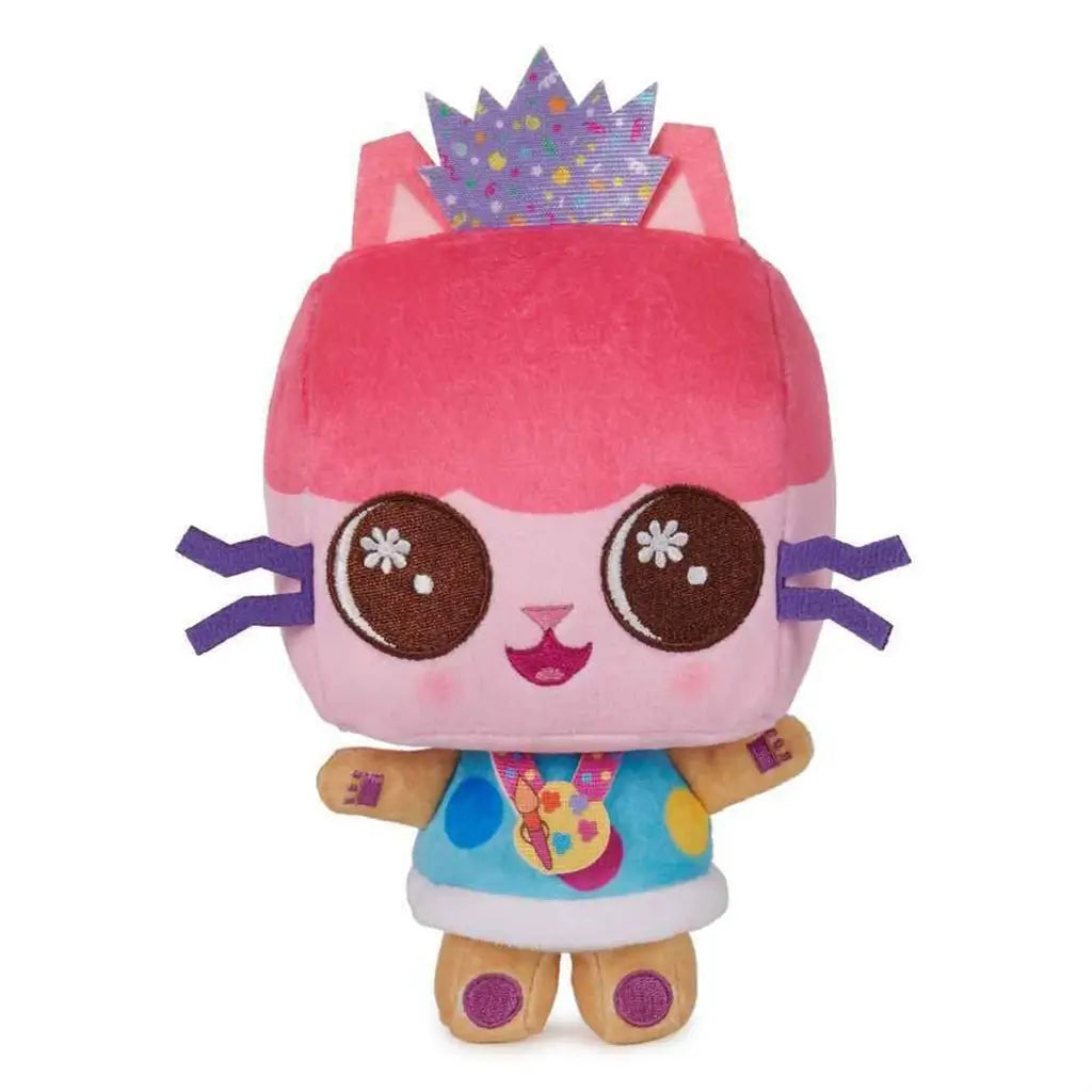 Gabby’s Dollhouse Baby Box Cat plush in bright pink, teal, and purple fabric with box-shaped head, stitched facial features, and decorative crown designed as a soft collectible toy displayed on a plain white background.