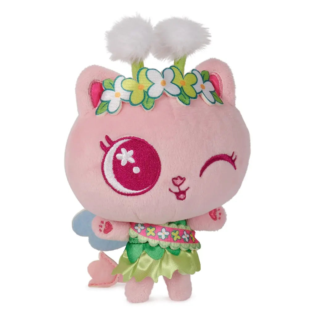 Gabby's Dollhouse Cakey Cat plush toy in pink and green soft fabric, rounded kitten shape with stitched facial features and floral crown, angled view highlighting dimensional design and cute styling.