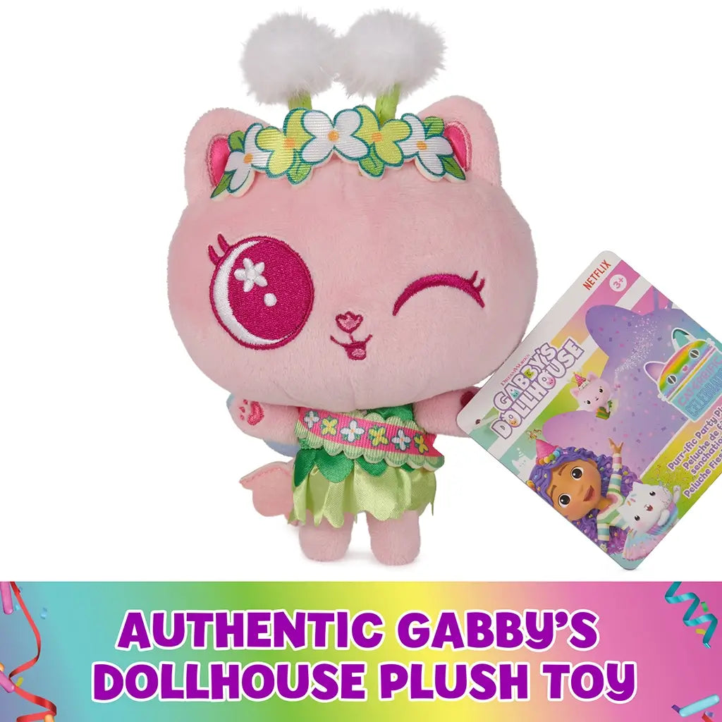 Gabby's Dollhouse Cakey Cat plush toy in pastel pink fabric, rounded kitten form with embroidered face and floral headband, displayed with branded tag on white background indicating authentic product.