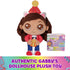 Gabby's Dollhouse plush toy in vibrant red, blue, and brown fabric, rounded doll shape with embroidered eyes and party hat, displayed with branded tag on white background, indicating authentic licensed product.