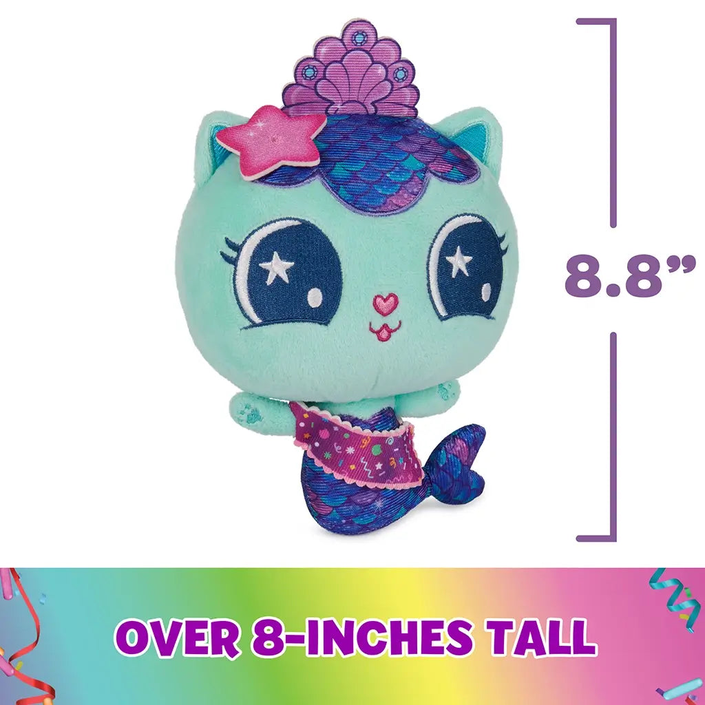 teal plush mermaid cat toy Gabby's Dollhouse, soft fuzzy fabric with purple and blue scaled tail, rounded small character shape with embroidered eyes and crown, shown with size graphic on a white background