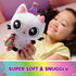 Gabby’s Dollhouse Pandy Paws plush toy white soft fabric cat with black ears, pink inner ears and embroidered face, holding rainbow accessory, cuddly character shown with child in cozy bedroom.
