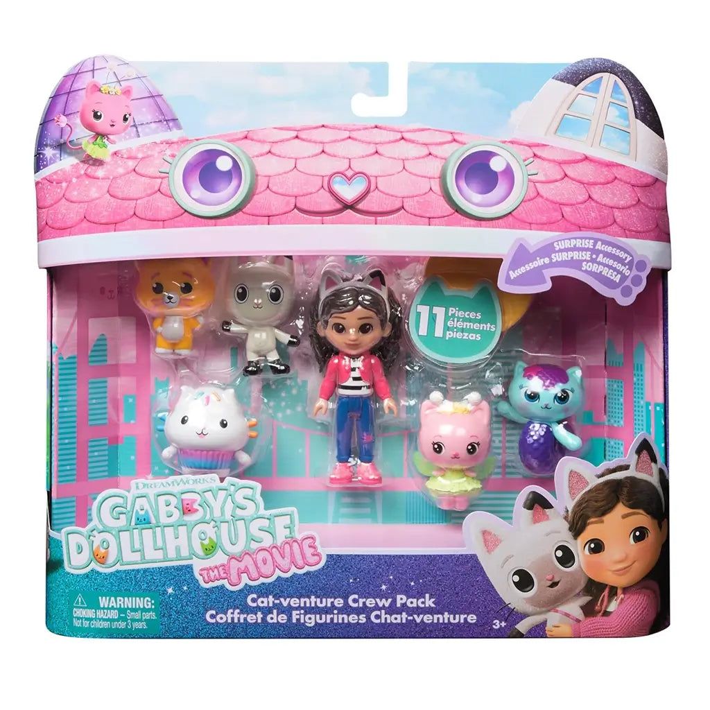 Gabby's Dollhouse The Movie Cat-Venture Crew Pack in pink and teal cardboard packaging with scalloped roof graphics, clear plastic window, and character figures displayed inside retail box.
