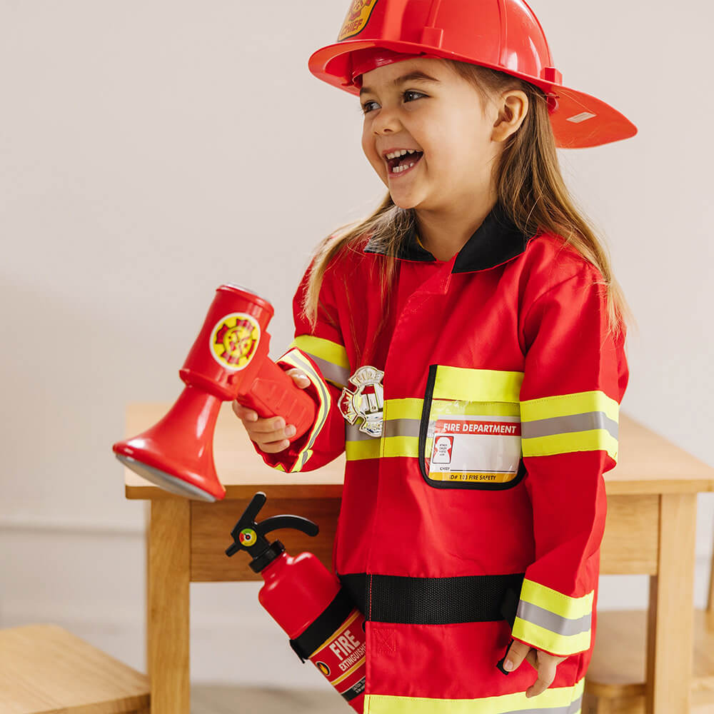 Girl using the bullhorn from the Melissa and Doug Fire Chief Role Play Costume Set