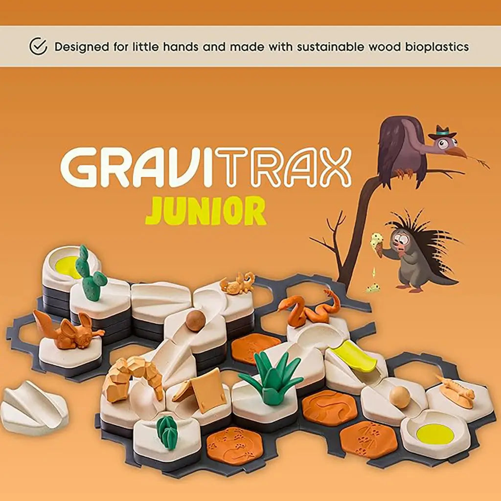GraviTrax Junior Desert Starter Set track layout with orange desert tiles, plants, and animals, promoted as designed for little hands and made from eco-friendly bioplastics.