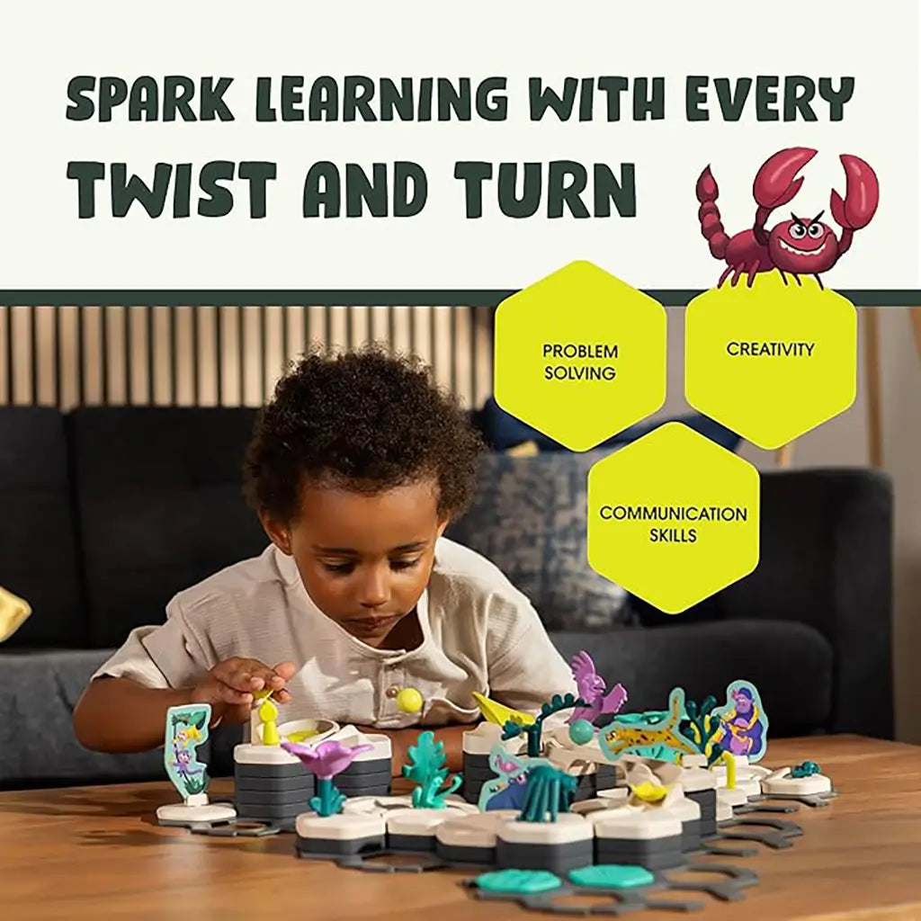 GraviTrax Junior Desert Starter Set shown with a child playing, highlighting skills like problem solving, creativity, and communication in a fun desert-themed track environment.