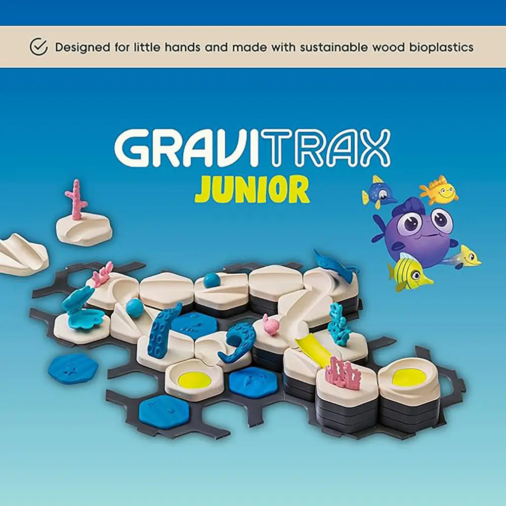GraviTrax Junior Ocean Starter Set displayed with hexagonal tiles, coral, and fish, highlighted as designed for little hands and made from sustainable wood bioplastics.